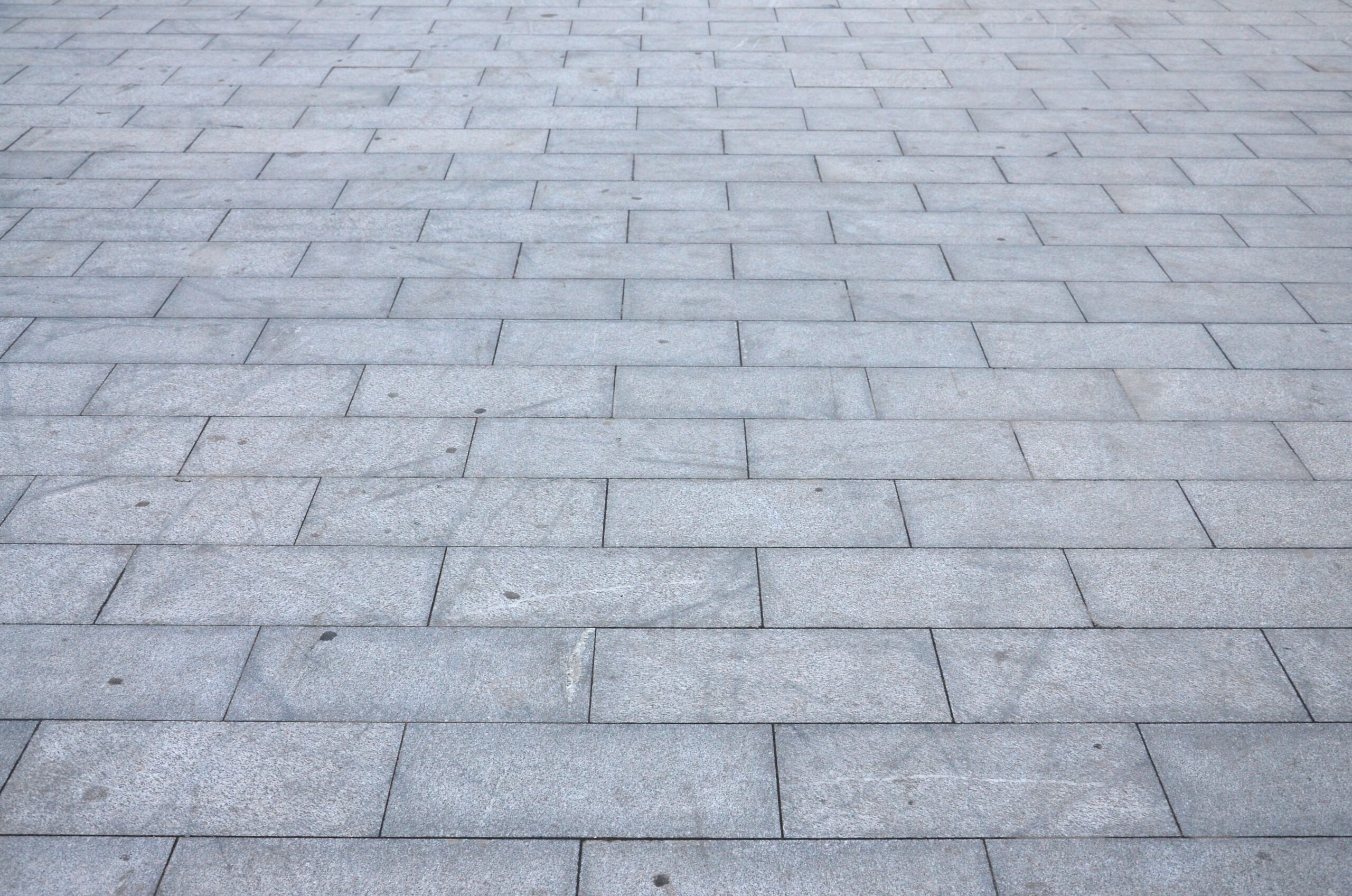 Pflasterarbeiten fragment of the square paved of a large granite ti 2021 08 29 08 46 15 utc scaled erdbau tiefbau erdbauarbeiten erdarbeiten